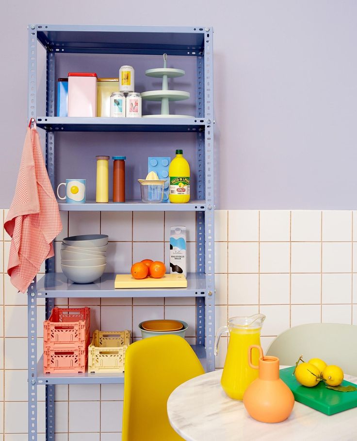 Color crates on the shelves of a pastel color kitchen