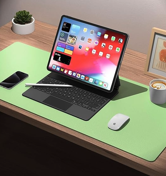 Green leather desk mat under the iPad