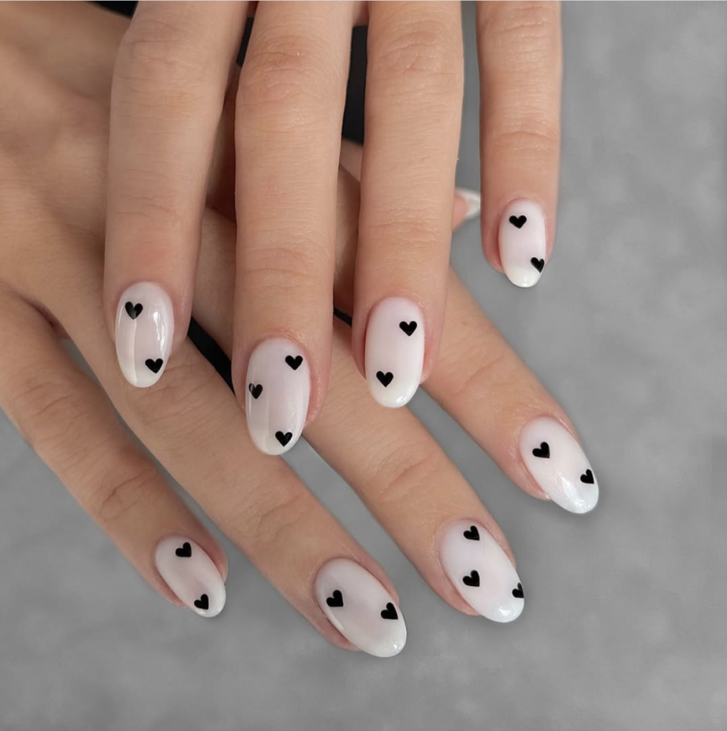 White nails with black hearts